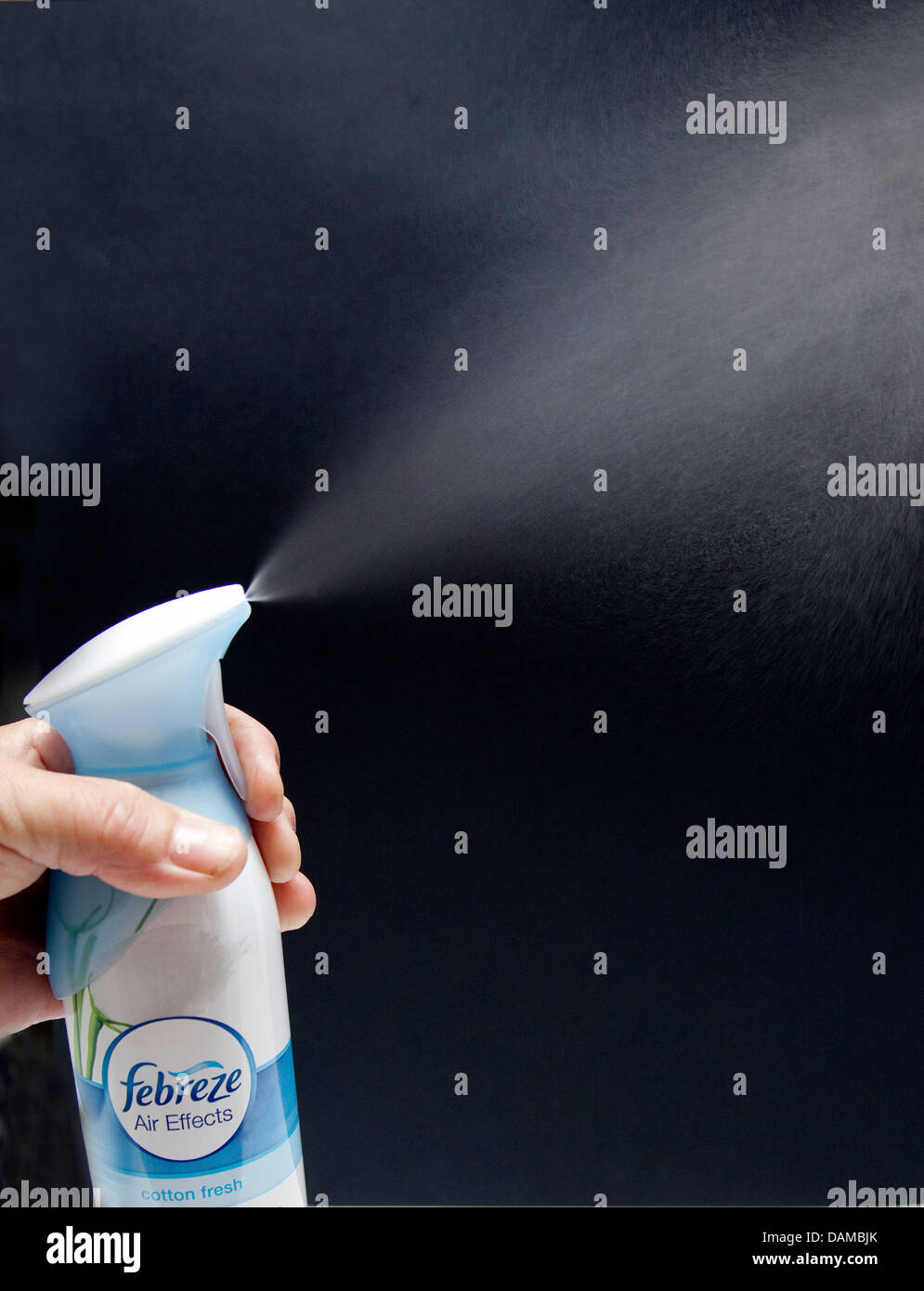 Using air freshener spray in the home, London Stock Photo
