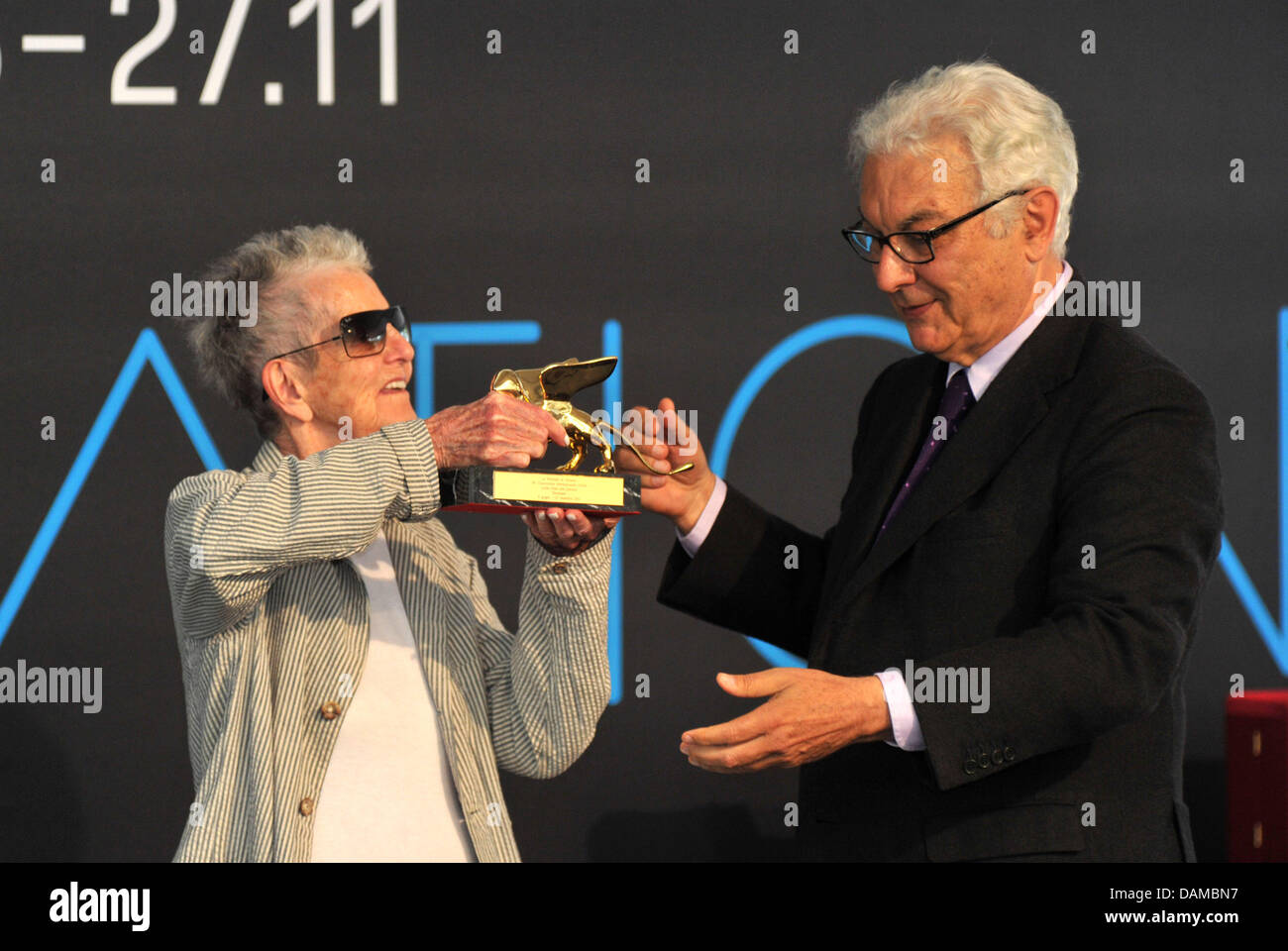 The president of the Venice Biennale, Paolo Baratta (R), hands over a Golden Lion for lifetime achievement to artist Elaine Sturtevant (L) during the opening of the 54th Venice Biennale in Venice, Italy, 04 June 2011. The Biennale takes place every two years in Venice, Italy. Photo: Felix Hoerhager Stock Photo