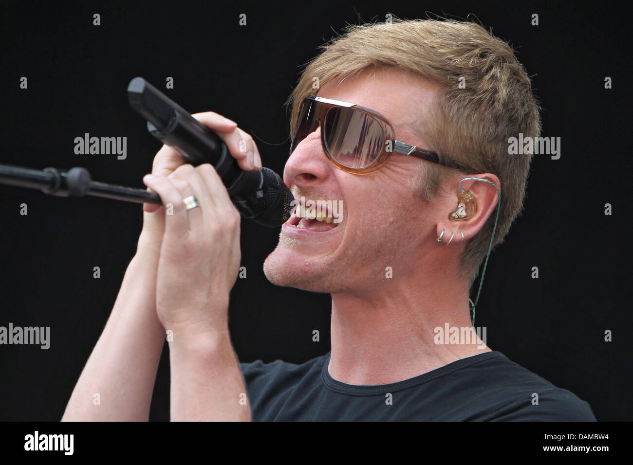 Belgian singer Ozark Henry performs during the music festival "Rock im Park" (rock in the park) in Nuremberg, Germany, 03 June 2011. Tens of thousands of rock music fan are expected at the festival on 5 June 2011. Photo: DANIEL KARMANN Stock Photo