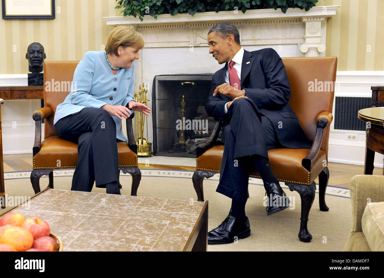 German Chancellor Angela Merkel and US President Barack Obama converse in  the Oval Office inside the White House in Washington, D.C., USA, 7 June  2011. Merkel is on a two-day-visit to the