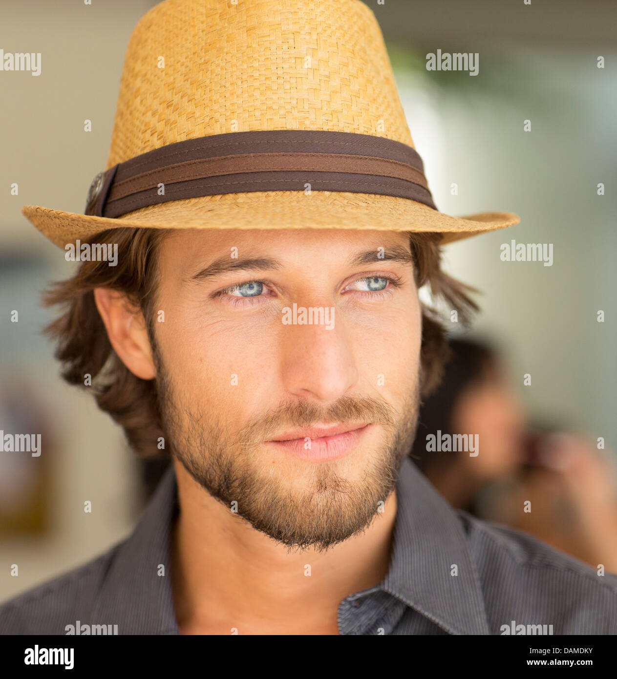 Smiling man wearing straw hat Stock Photo