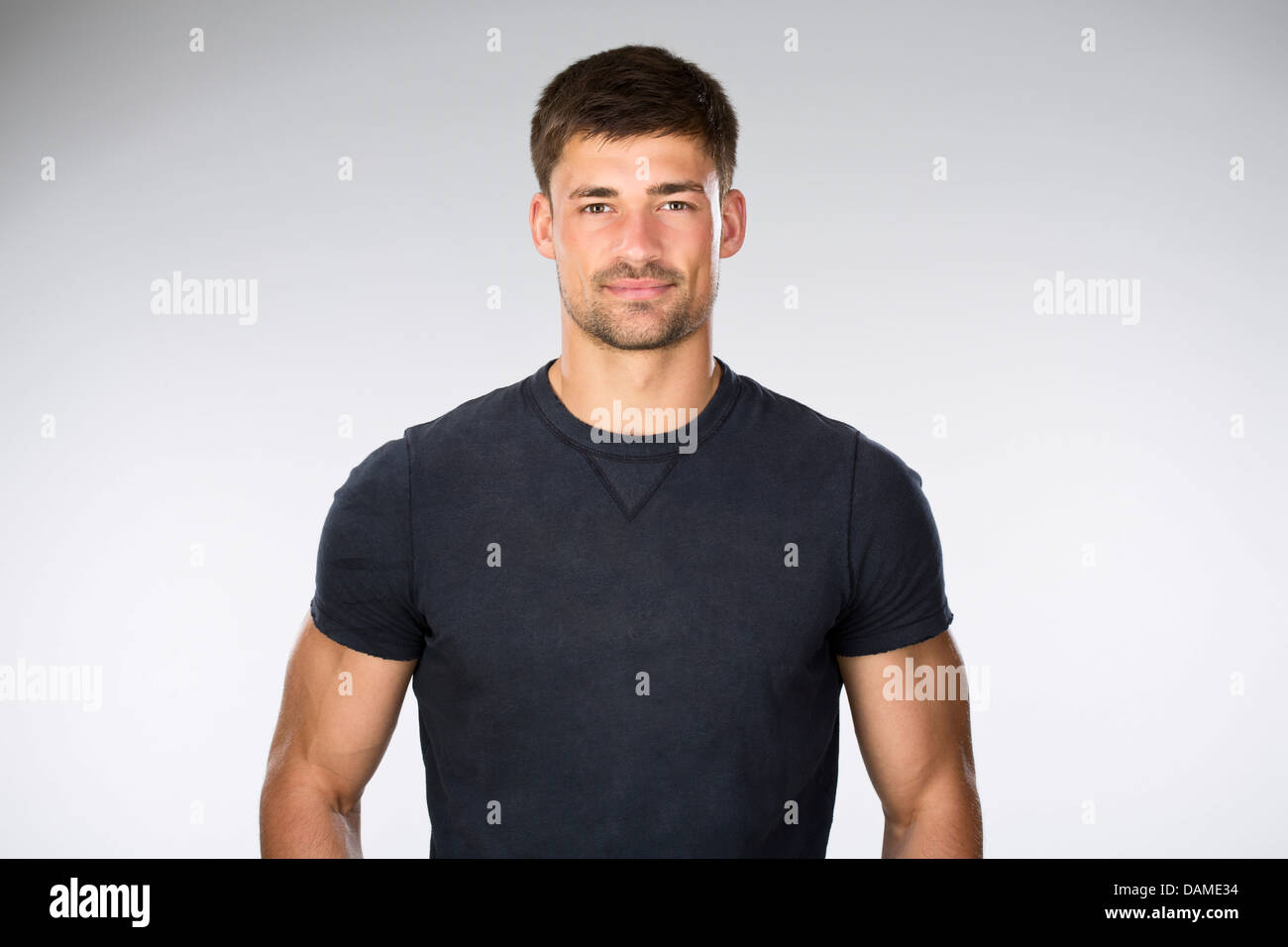 Portrait of young man against white background Stock Photo - Alamy