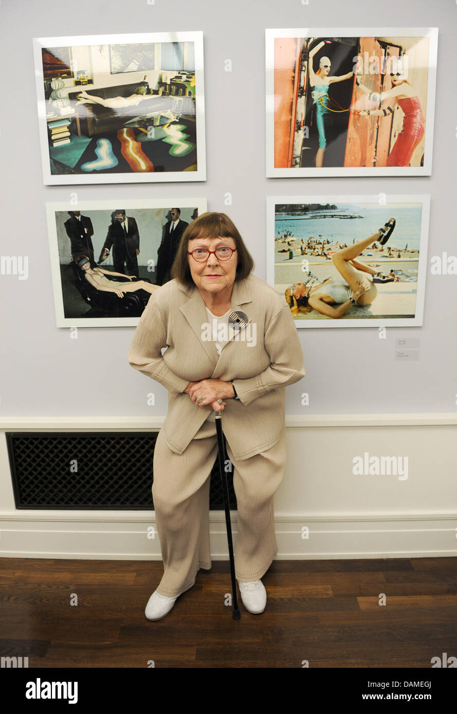 June Newton, the widow of Helmut Newton, poses in front of enlarged polaroid  photos of her husband at the Museum of Photography in Berlin, Germany, 09  June 2011. Between 10 June 2011