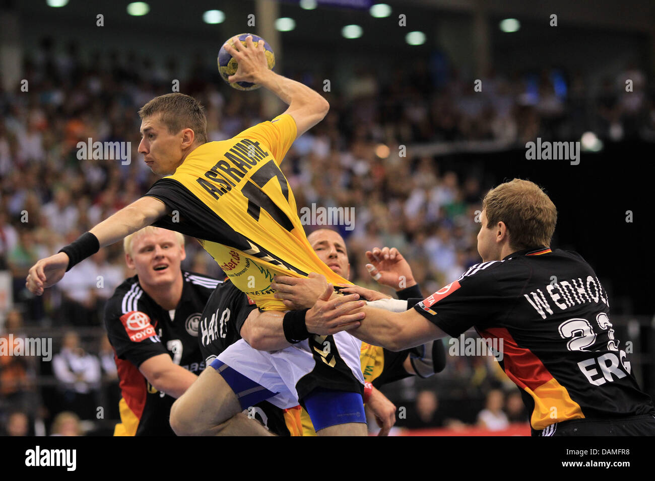 Professional handball player Arnolds Straume (C) from Latvia and