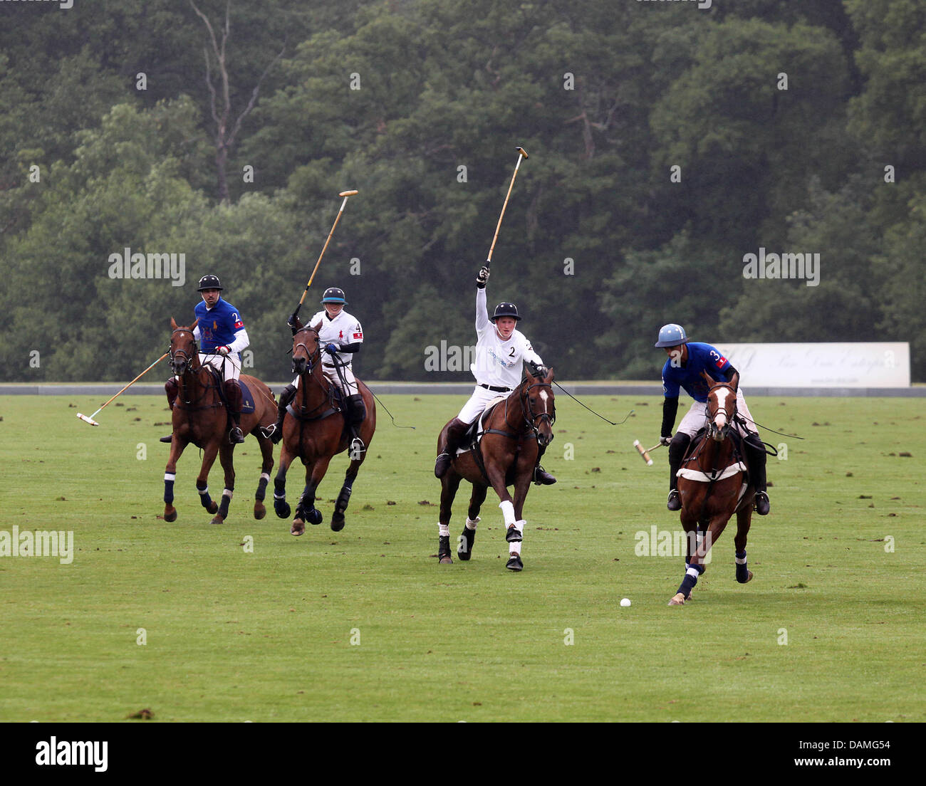 Britain's Prince Harry (2nd to R) plays during the Sentebale Polo Cup at the Coworth Polo Club in Berkshire, Britain, 12 June 2011. Prince Harry played for the Sentebale team. Photo: Albert Nieboer NETHERLANDS OUT Stock Photo