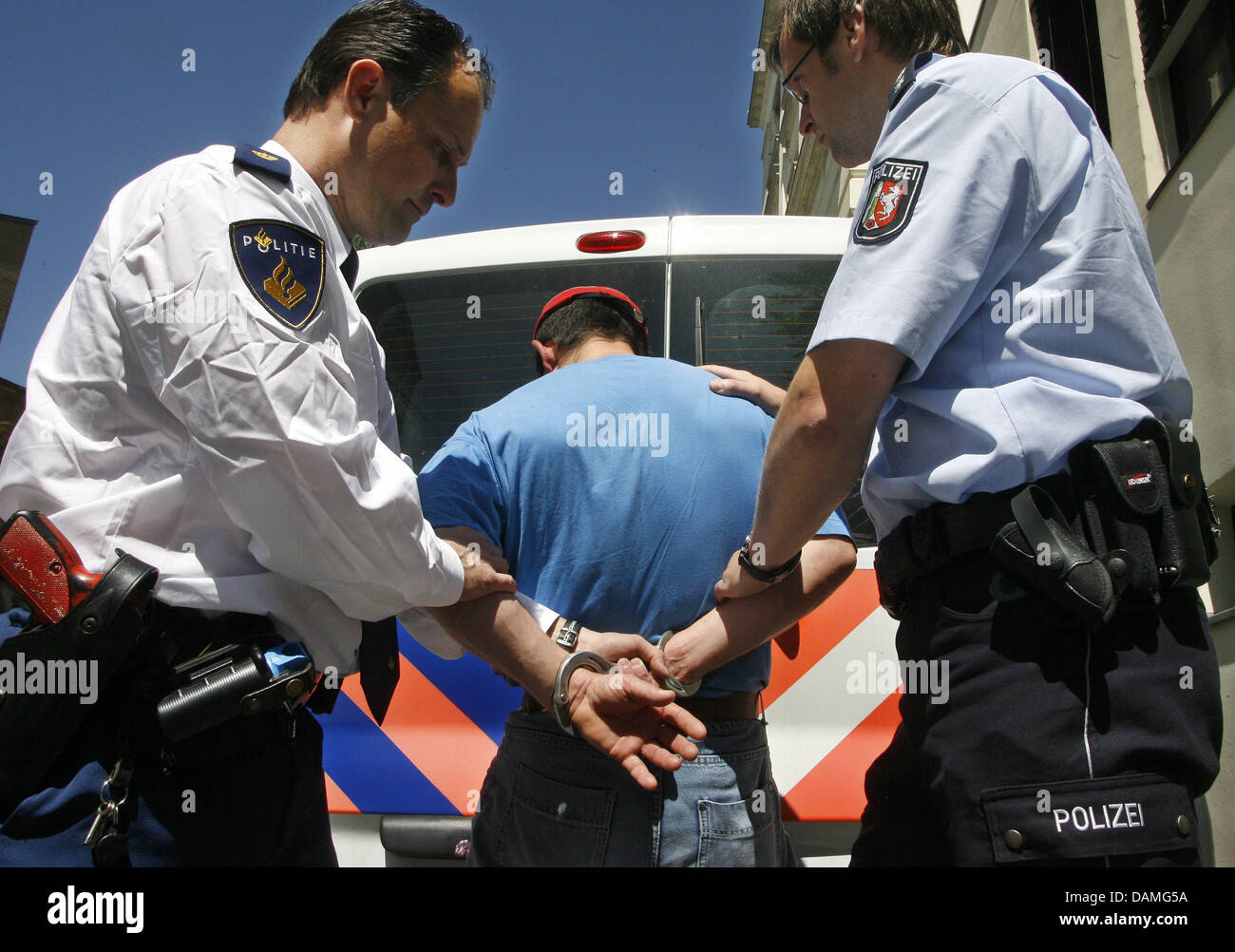 German and Dutch police stage an arrest in Moenchengladbach, Germany