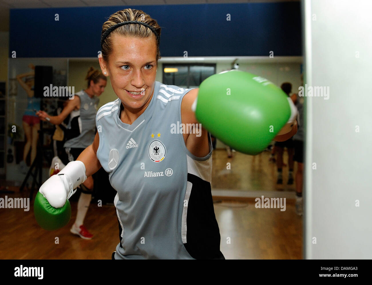 Lena Goessling of the German national soccer team punches a bag during a training session at a Fitness First club in Frankfurt am Main, Germany, 13 June 2011. Photo: THORSTEN WAGNER/BONGARTS/GETTY IMAGES Stock Photo