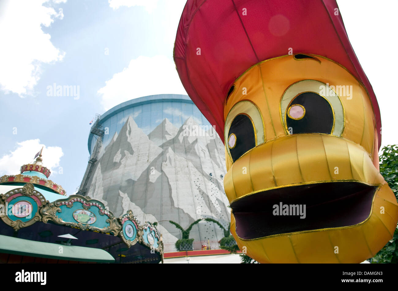 A figure stands in front of a former cooling tower at the 'Wunderland Kalkar' amusement park in Kalkar, Germany, 9 June 2011. In 1995, Dutchman Hennie van der Most bought the former nuclear power plant 'Schneller Brueter' and turned it into a hotel and leisure centre. Photo: Maximilian Haupt Stock Photo