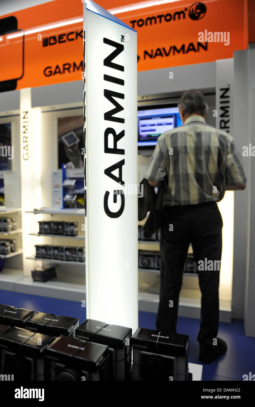 visitor to an electronic store stands behind the name of the American gps navigation device manufacturer Garmin in Munich, Germany, 15 June Market leader Garmin takes over the Hamburg