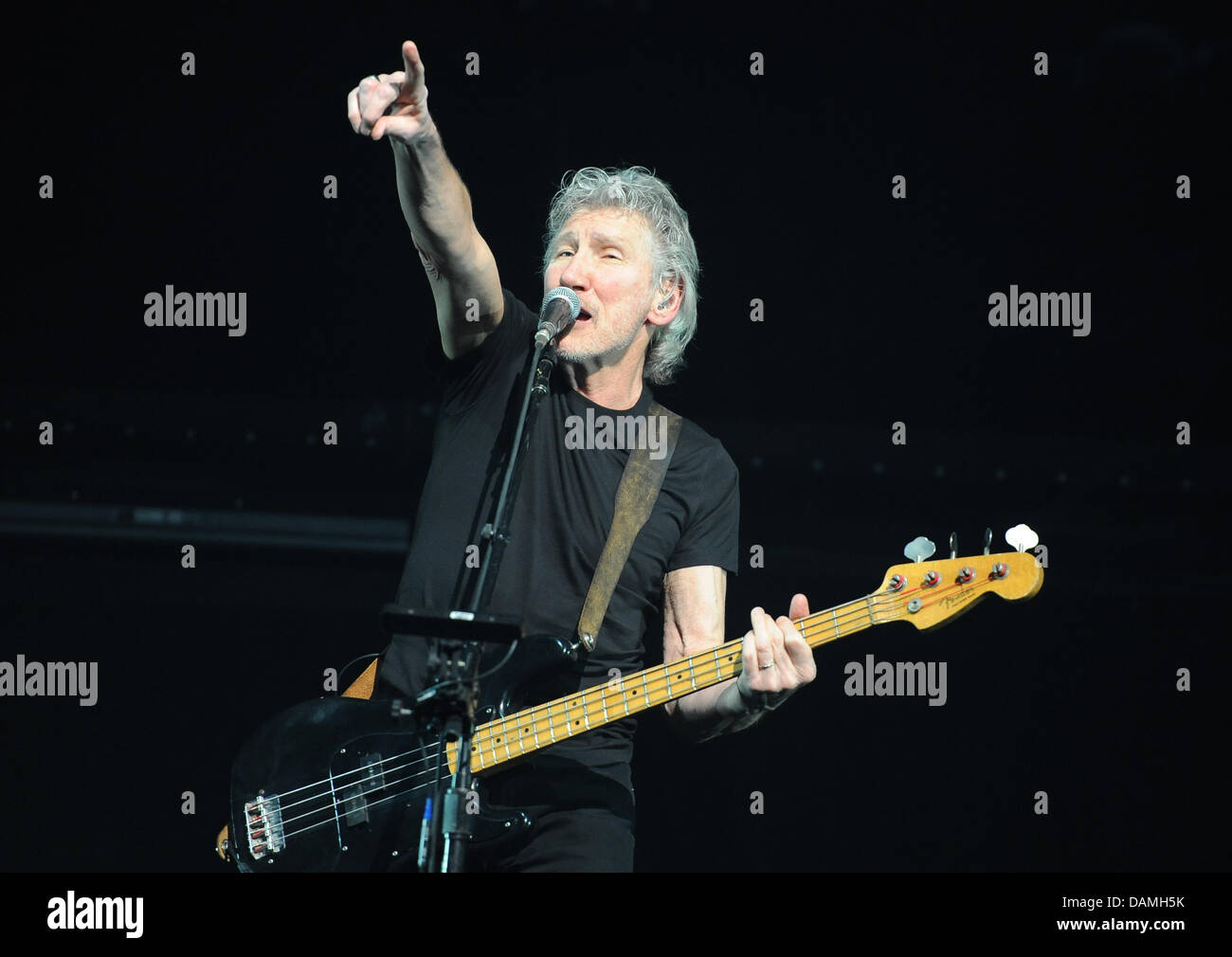 British singer, bassist and founding member of the band Pink Floyd, Roger Waters (L), performs on stage at o2 World in Berlin, Germany, 15 June 2011.  Since 1990 the singer presents the show 'The Wall' the first time in full length again. Photo: Britta Pedersen Stock Photo