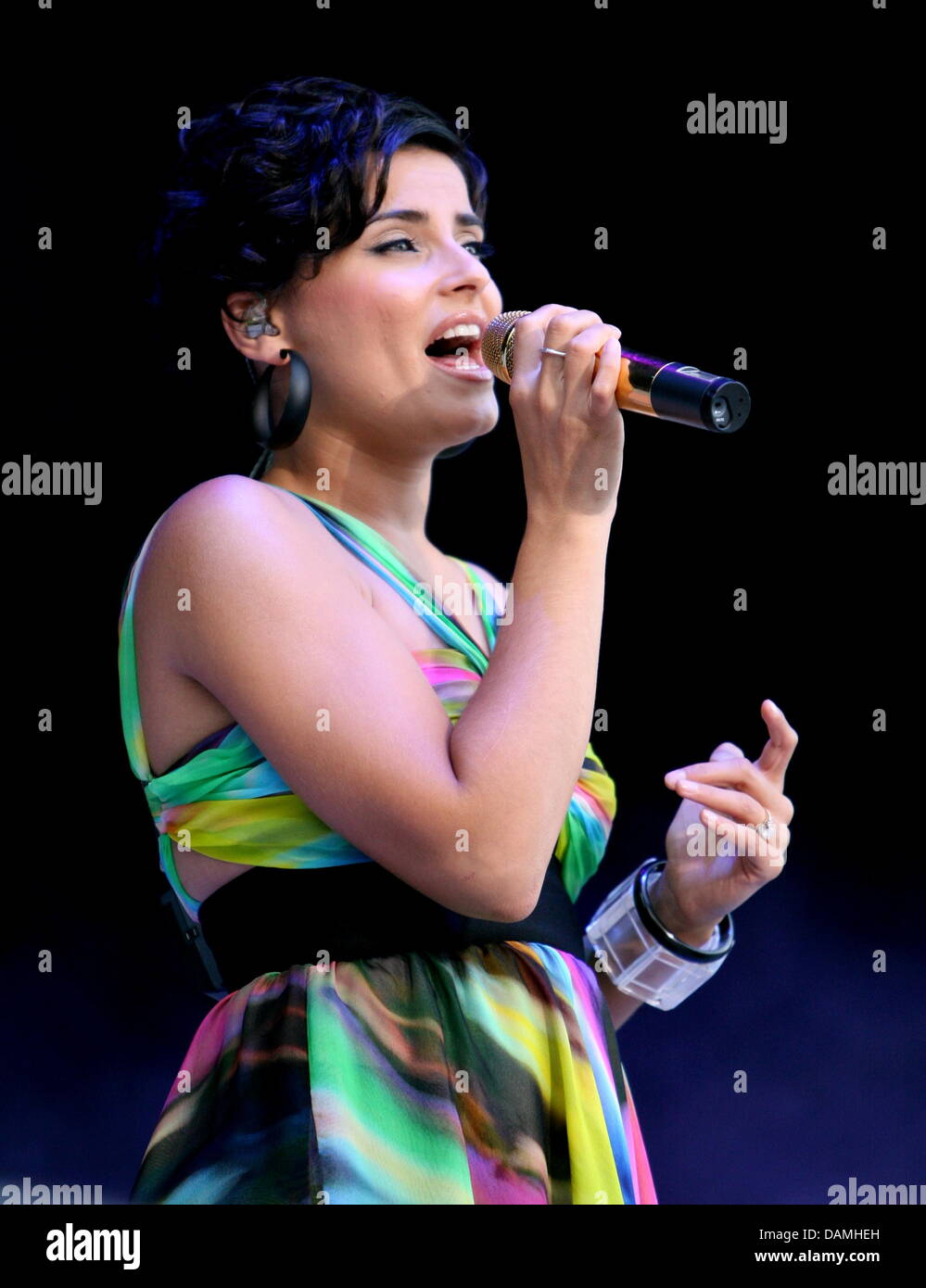 (dpa file) - A file picture dated 8 July 2008 of singer Nelly Furtado at a concert in Munich, Germany. In the case of two young hackers stealing unpublished songs through the internet, the defense plans to hear US artists affected by the attack. Among others,  Lady Gaga, Justin Timberlake and Nelly Furtado are to testify. It is not to understand that the artists' computers were not Stock Photo