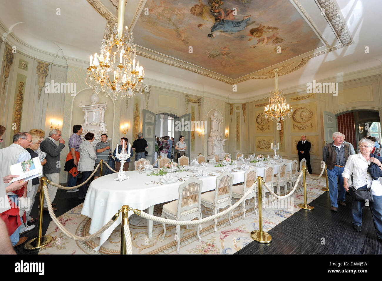 The table in the garden hall is aesthetically decorated in Meseberg Palace in Meseberg, Germany, 18 June 2011. The Palace, that is used as guests' house by the federal gouvernment since 2007, had invited for an Open House day. Photo: BERND SETTNIK Stock Photo