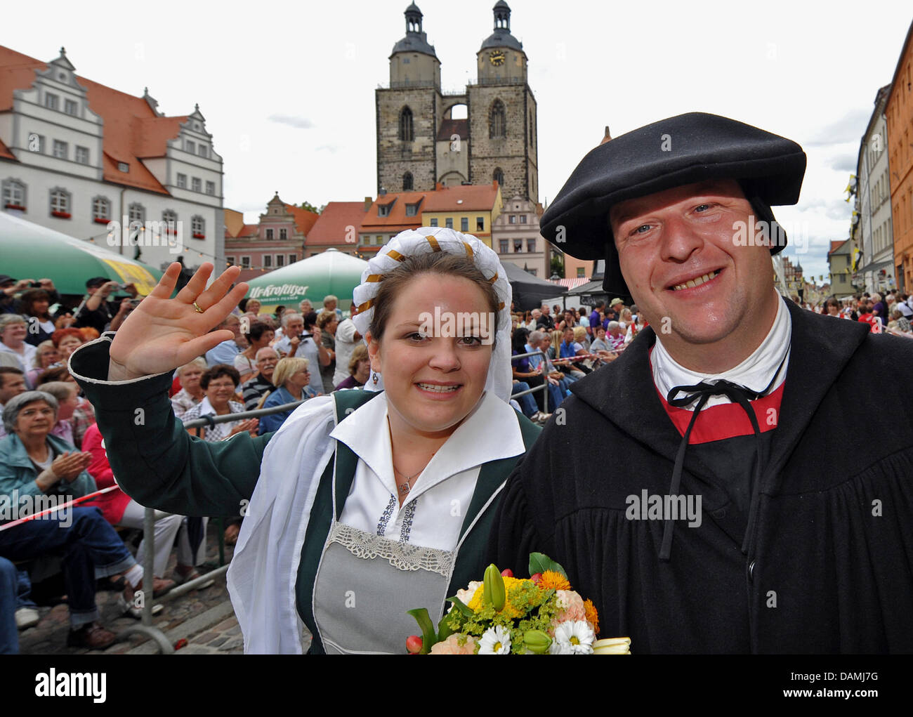 The couple Franziska Kuehnemann and Torsten Lange act as Luther couple, performing the wedding of theologist and reformer Martin Luther and nun Katharina of Bora, during the pageant in front of the city's church in Wittenberg, Germany, 18 June 2011. Franziska Kuehnemann is a direct descendant of Luther in the 15th generation. Luther's wedding in 1525 has been celebrated since 1994  Stock Photo