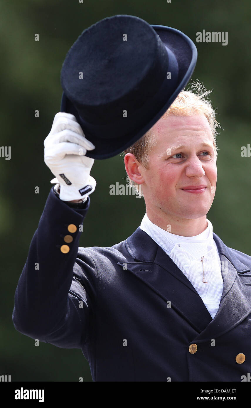 Rider Matthias Rath takes off his hat after his competition at the ...