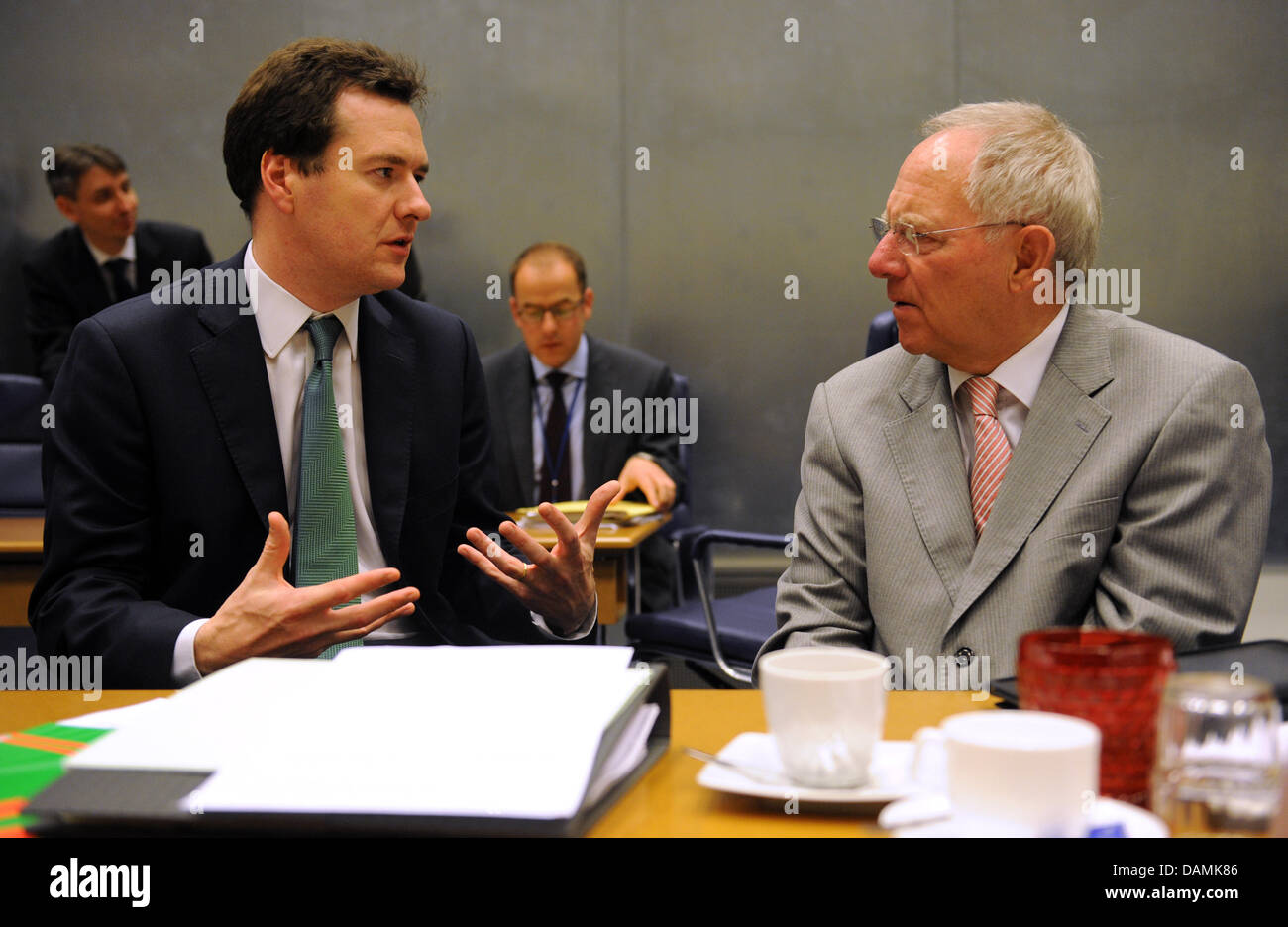 German Finance Minister Wolfgang Schaeuble (R) talks to Britain's Finance Minister George Osborne at the meeting of the finance ministers in Luxembourg, Luxembourg, 20 June 2011. The EU finance ministers discuss further help for Greece. Photo: RAINER JENSEN Stock Photo