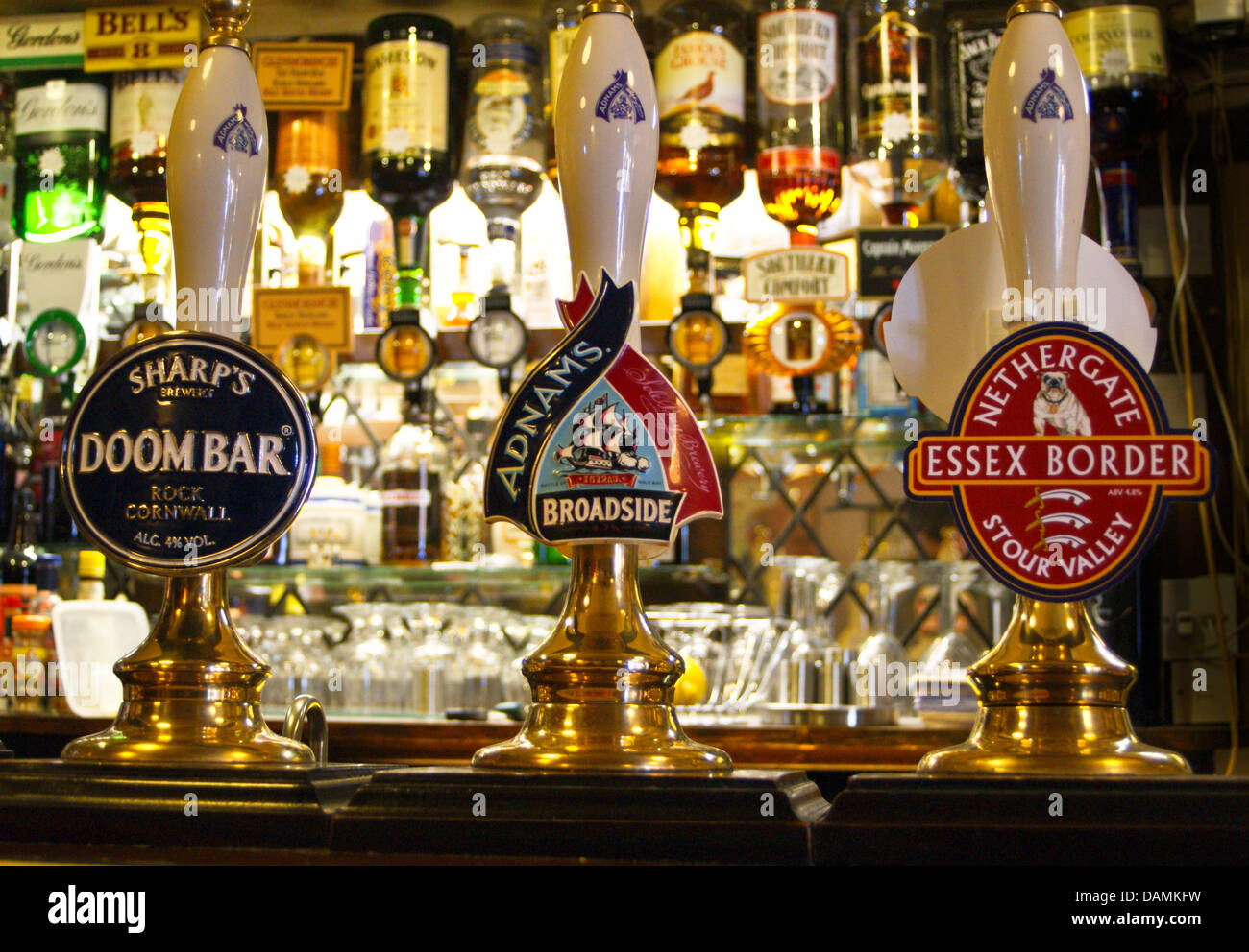 Real ale handpumps and pump clips on a pub bar Stock Photo