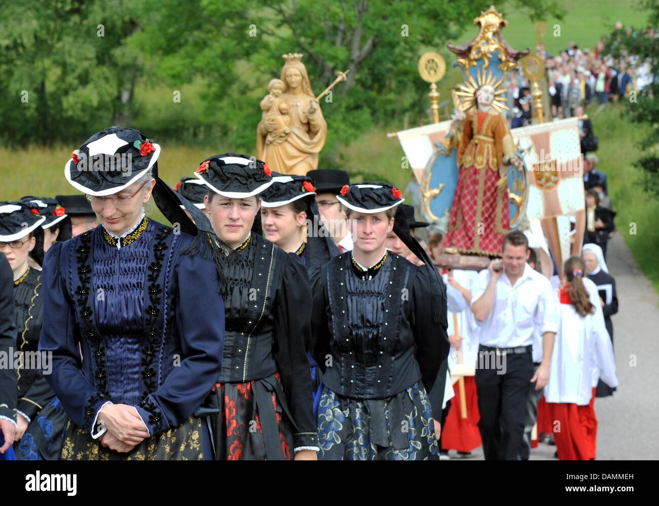 Believers dressed in traditional clothing the Corpus Christi