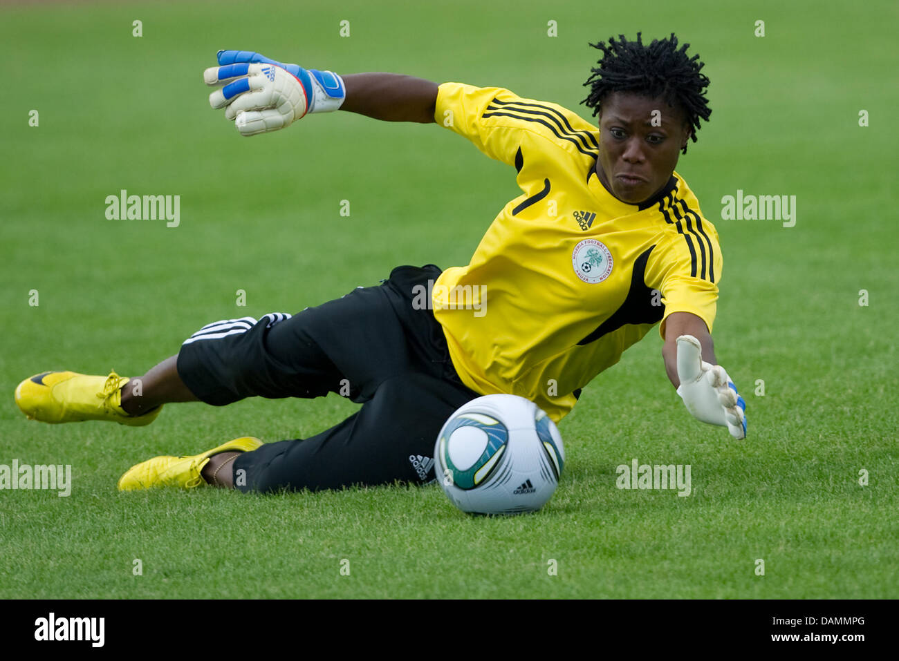 The Nigerian national goalkeeper Precious Dede saves the ball during a practice session in Heidelberg, Germany, 23 June 2011. On 26 June 2011, Nigeria will play its first World Cup group match against France. Photo: Uwe Anspach Stock Photo