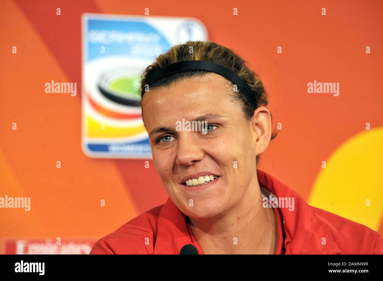 Canadian national soccer player Christine Sinclair smiles at a press conference initiated as part of a new image-campagne for women's soccer at the media centre of the Olympic Stadium in Berlin, Germany, 24 June 2011. Players of the German and Canadian national team support the media initiative. Photo: Carmen Jaspersen Stock Photo