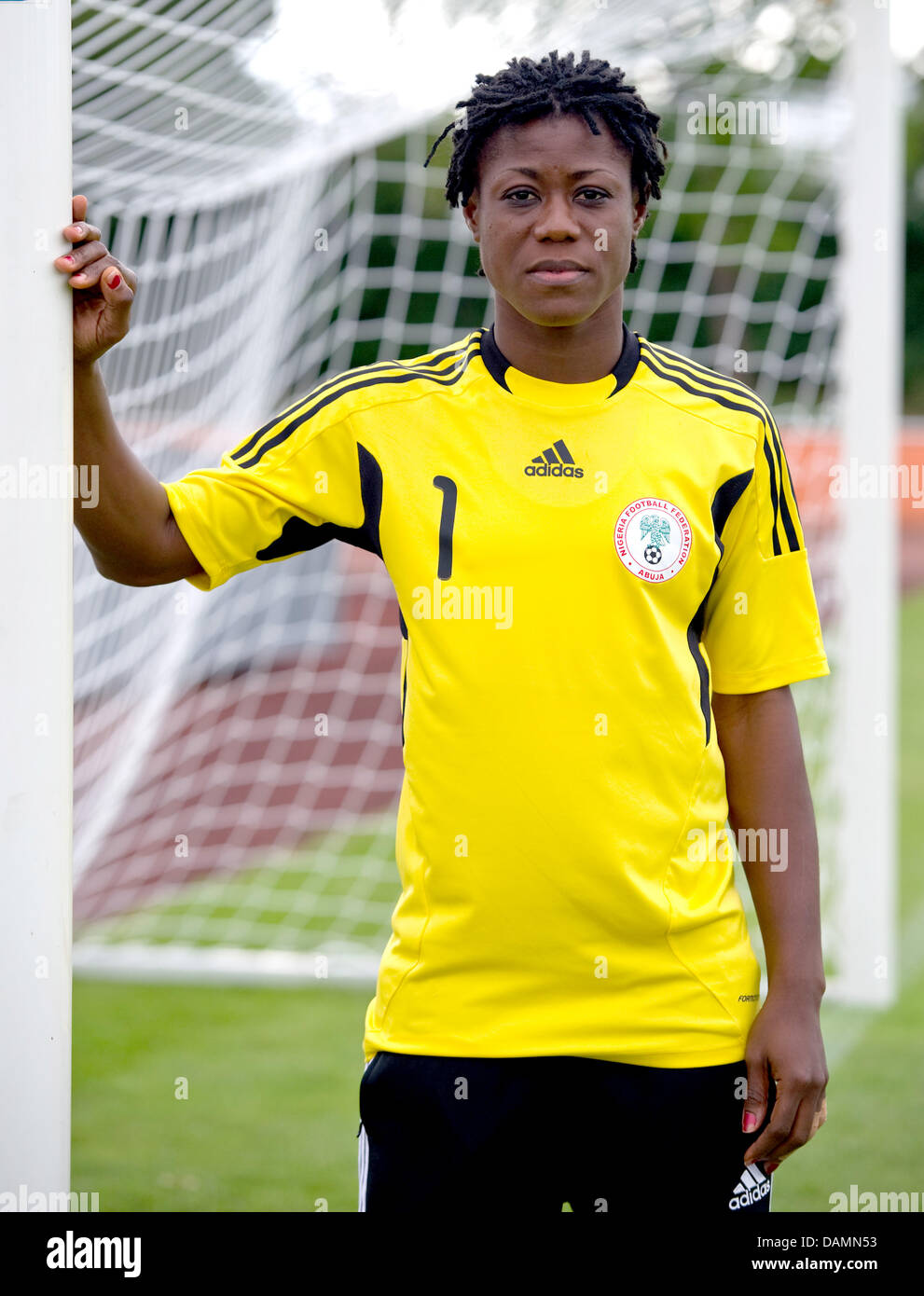 The goalkeeper of the Nigerian national women's soccer team, Precious Dede, stands at a goalpost during practice in Heidelberg, Germany, 23 June 2011. The Nigerian team plays its first match against France on 26 June 2011. Photo: Uwe Anspach Stock Photo