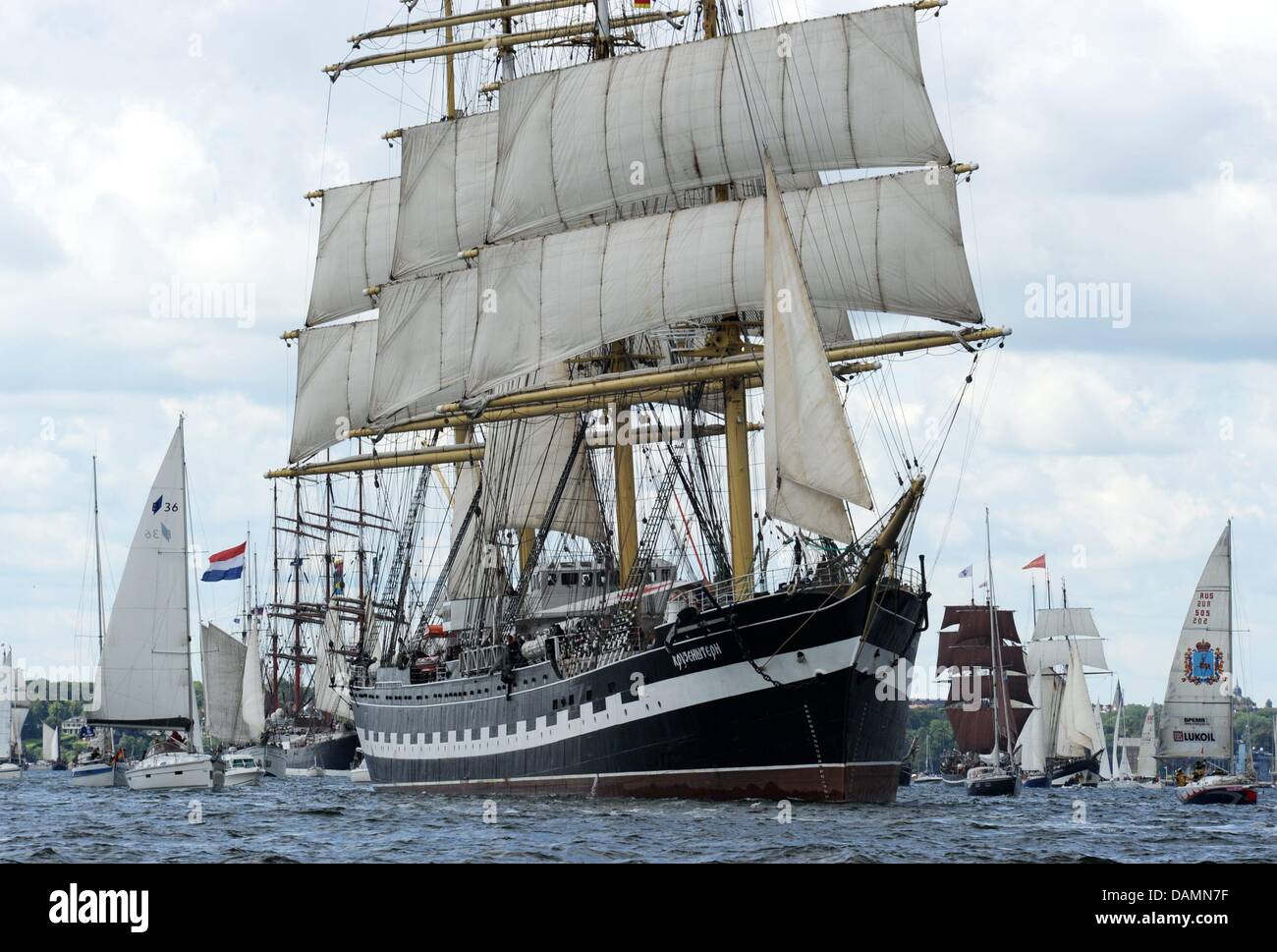 The Russian four-masted barque 'Kruzenshtern' heads into the Baltic Sea during the traditional windjammer parade of the Kiel Week in Kiel, Germany, 25 June 2011. Approximately 120 tall and traditional ships plus tenders participate in the event. Tens of thousands of people watch the parade on land and sea. Photo: Carsten Rehder Stock Photo
