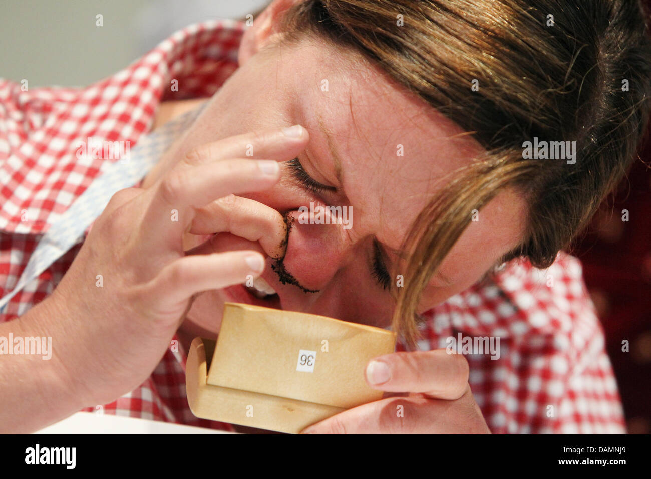 tobacco up the nose Contestant Gisela Bestle stuffs tobacco into her nose during her turn in  the 44th German snuff tobacco championship in Kucha, Germany, 25 June 2011.  The aim is to sniff as much tabocco