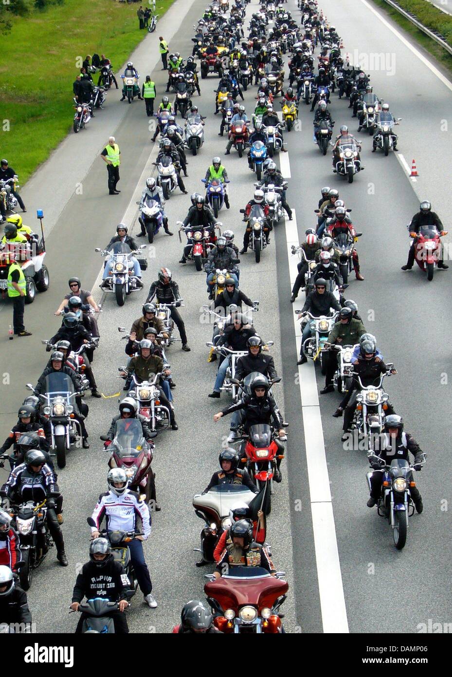 After a traditional motorcycle church service in Hamburg, tens of thousands of motorcyclists ride on closed off highway A7 near Kaltenkirchen, Germany, 26 June 2011. The highway A7 from Hamburg-Stellingen to Bad Bramstedt is closed off for two and a half hours. The police reported 29,000 participants and for the first time, 3000 Hamburg Harley Days participants were part of the con Stock Photo