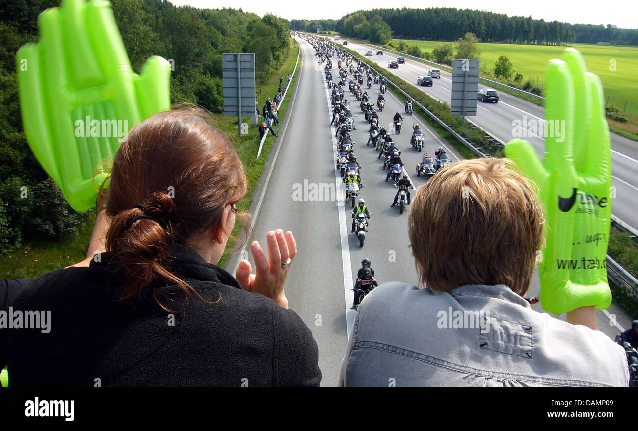 After a traditional motorcycle church service in Hamburg, tens of thousands of motorcyclists ride on closed off highway A7 near Kaltenkirchen, Germany, 26 June 2011. The highway A7 from Hamburg-Stellingen to Bad Bramstedt is closed off for two and a half hours. The police reported 29,000 participants and for the first time, 3000 Hamburg Harley Days participants were part of the con Stock Photo