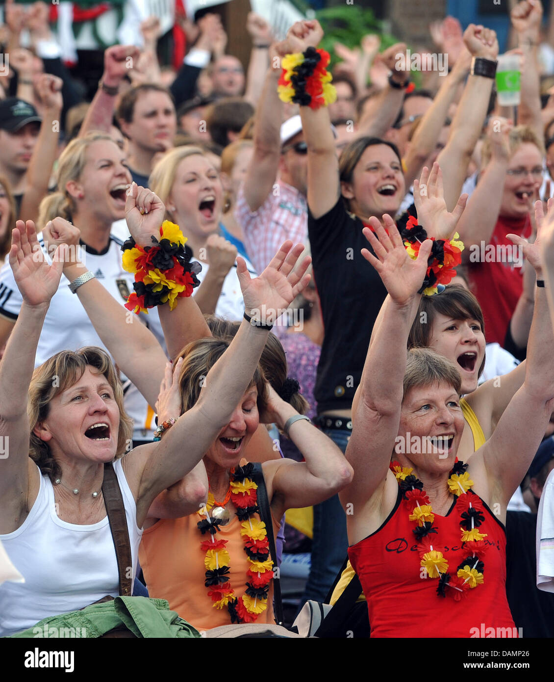 Women's soccer fans celebrate the FIFA Women's World Cup 2011 Group A match Germany vs. Canada at the Stadtmarkt in Augsburg, Germany, 26 June 2011. Augsburg is the only Bavarian venue during the FIFA Women's World Cup 2011. Three group stage matches and one quarter final will be played in Augsburg. The cultural side program takes place under the motto 'City of Peace'. Photo: Stefa Stock Photo