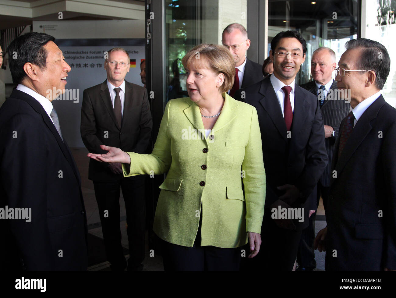 German Minister for Economic Affairs Philipp Roesler (2-r) and German Chancellor Angela Merkel (m) receive the Chinese Minister for Economic Affairs Zhang Ping (l) and Chinese Prime Minister Wen Jiabao (r) at a hotel in Berlin, Germany, 28 June 2011. The politicians will take part in the first German and Chinese government consultations and attend the 6th seminar of the German and  Stock Photo