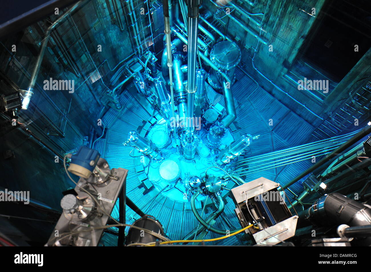 Blue light highlights the section of a cooling pool for nuclear fuel rods at the nuclear research reactor FRM II in Garching near Munich, Germany, 7 June 2011. Neutrons are generated in the reactor basin for scientific and medical research purposes as well as for industrial applications. Photo: Marc Mueller Stock Photo