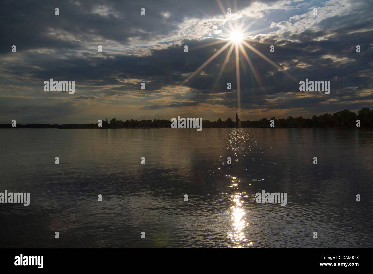 the last sunbeams before a rising storm over the Chiemsee, Germany, Bavaria, Lake Chiemsee, Seebruck Stock Photo