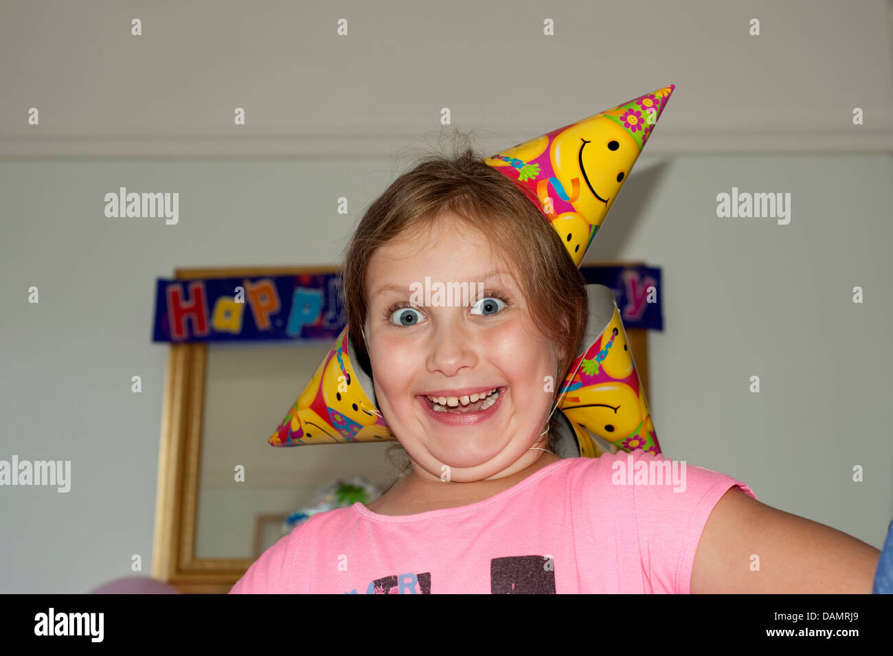 Young girl crazy excited at Birthday Party Funny . FULLY MODEL RELEASED Stock Photo