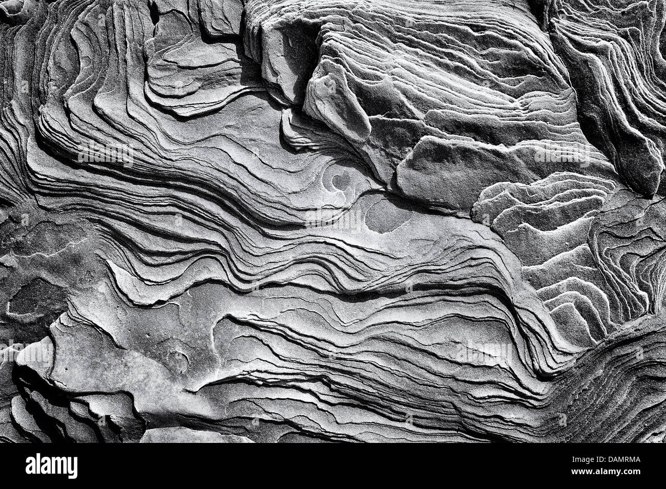 Sandstone rock strata pattern, Northumberland, England. Monochrome Stock Photo