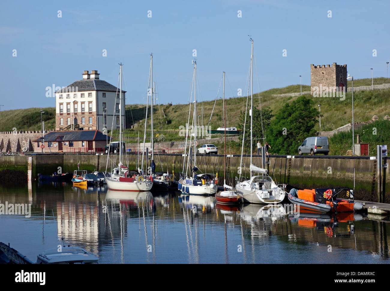 Eyemouth harbour in East Lothian Scotland with Gunsgreen House and