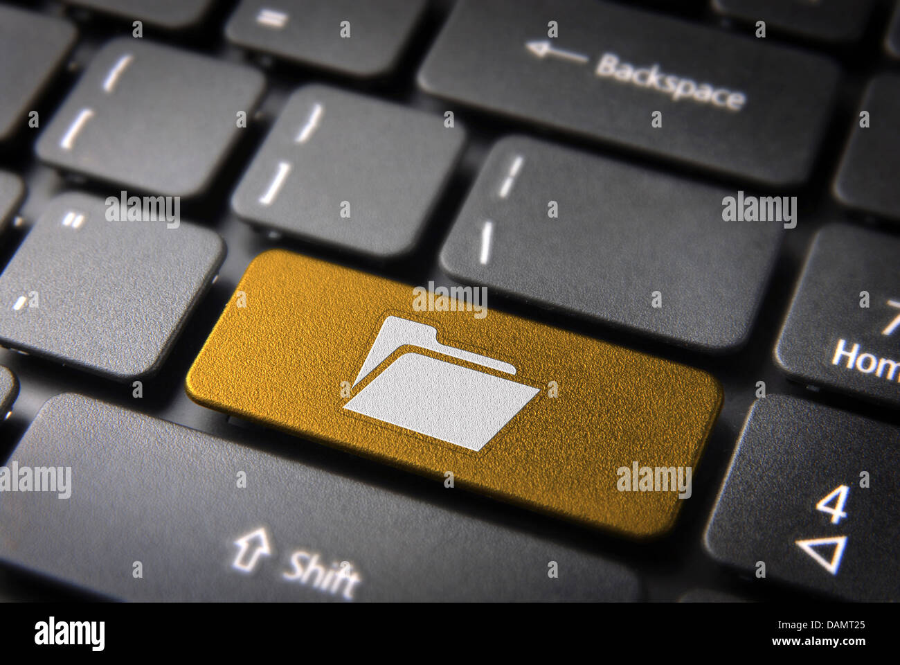 Software key with folder icon on laptop keyboard. Included clipping path, so you can easily edit it. Stock Photo