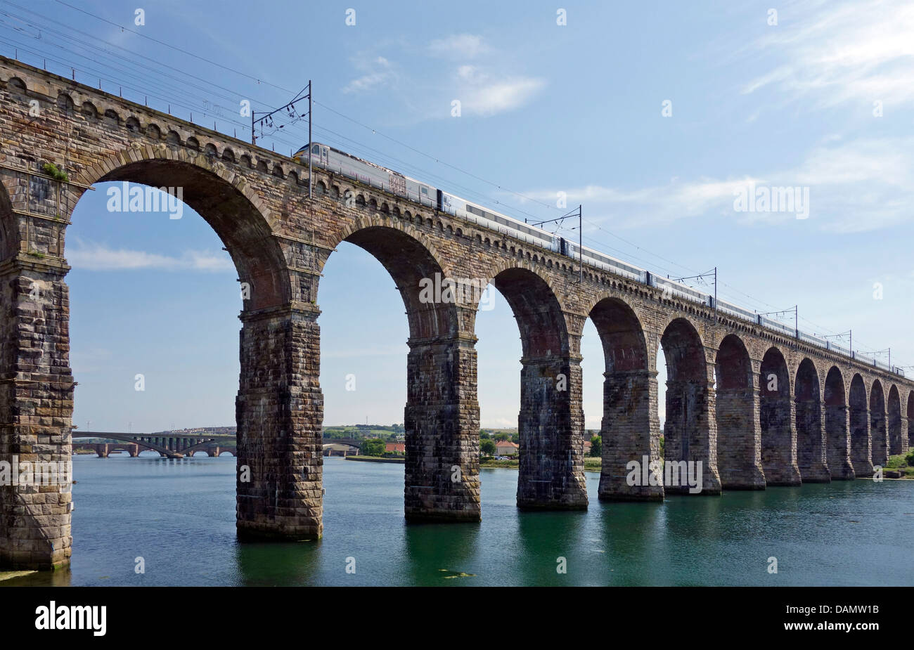 The Royal Border Bridge in Berwick -upon-Tweed England with northbound East Coast electric train heading towards Edinburgh Stock Photo