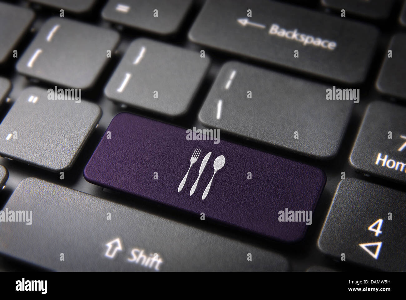 Food key with dishware icon on laptop keyboard. Included clipping path, so you can easily edit it. Stock Photo