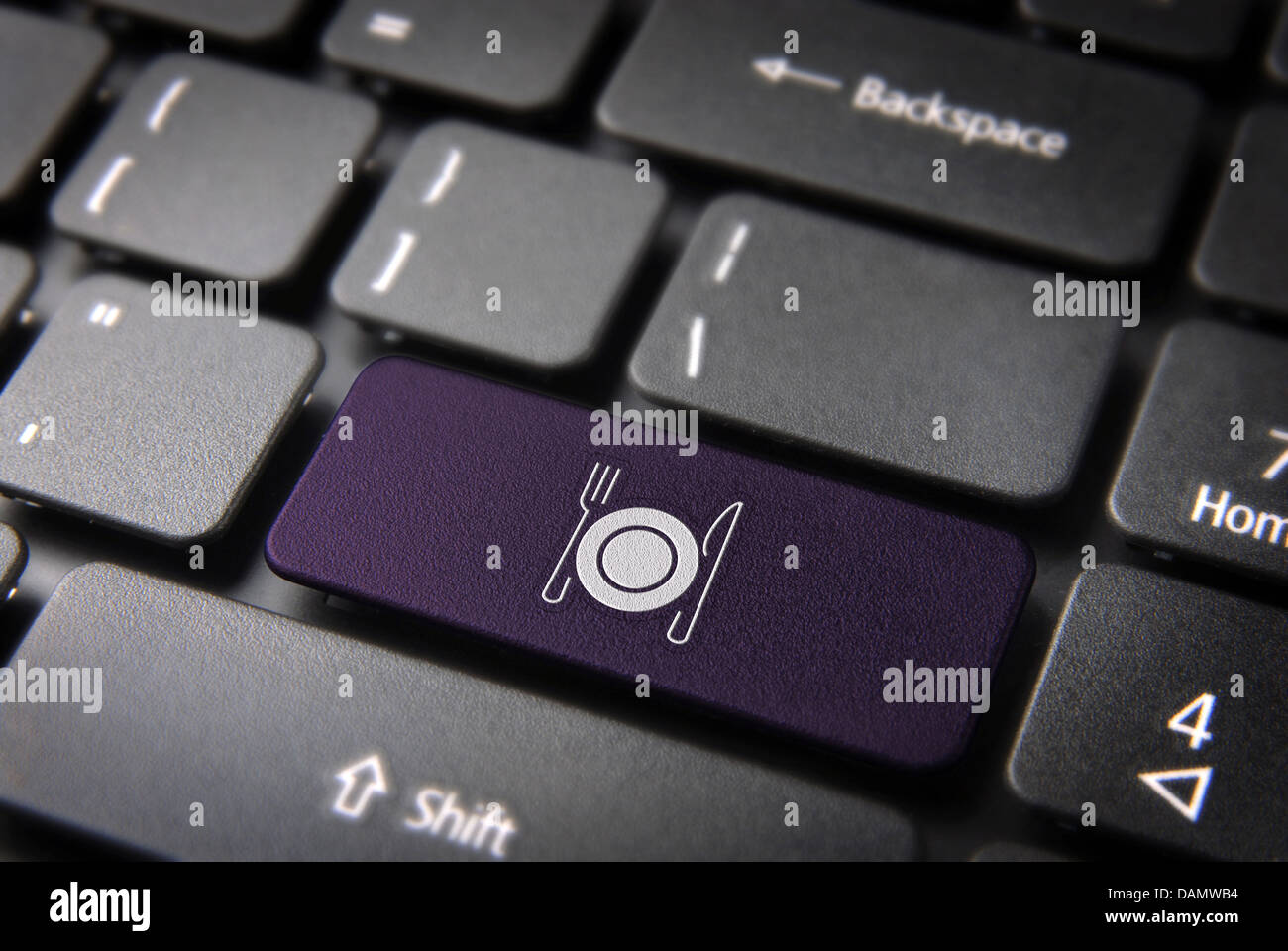 Food key with plate and dishware icon on laptop keyboard. Included clipping path, so you can easily edit it. Stock Photo