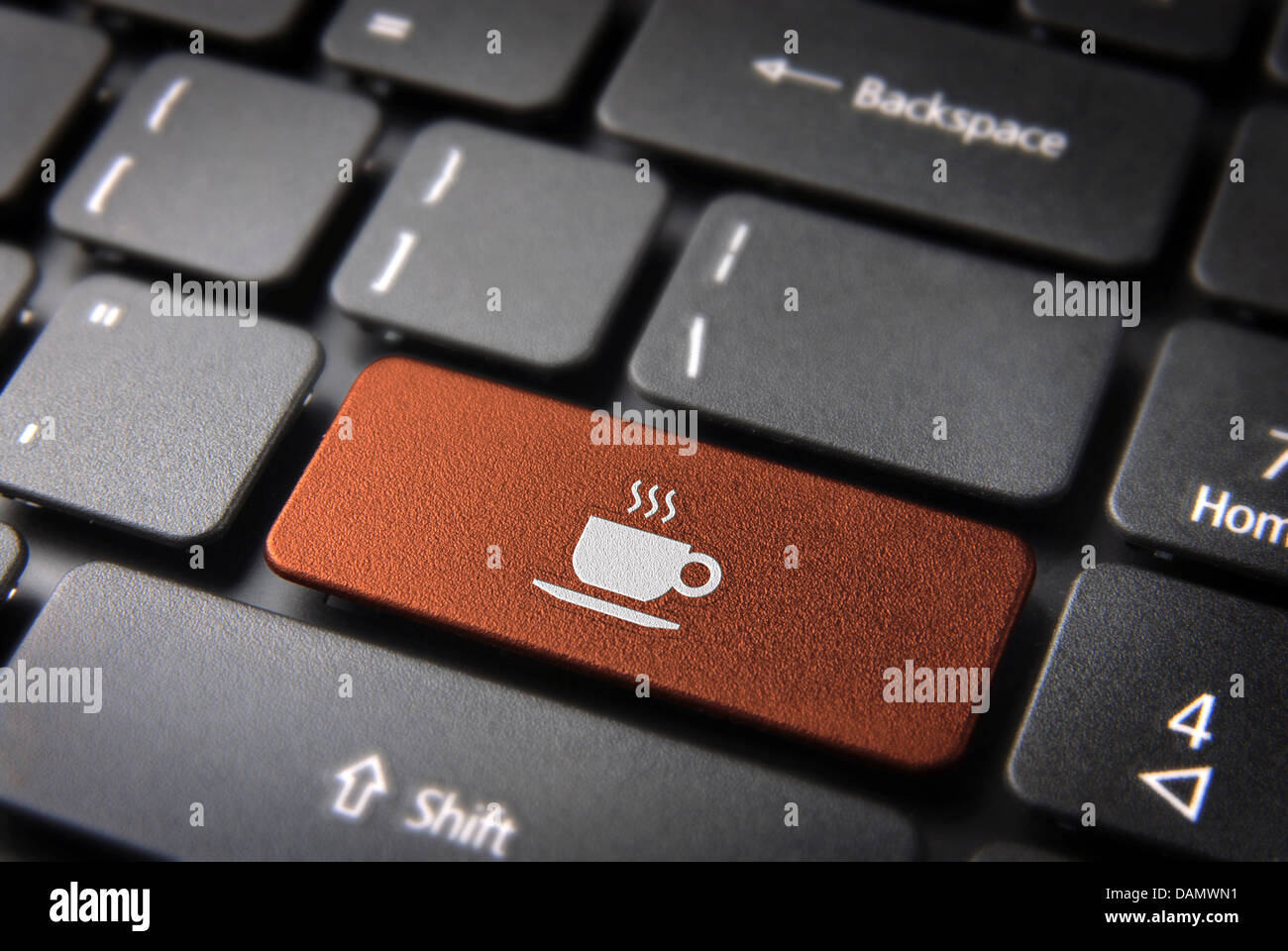 Food key with Coffee cup icon on laptop keyboard. Included clipping path, so you can easily edit it. Stock Photo