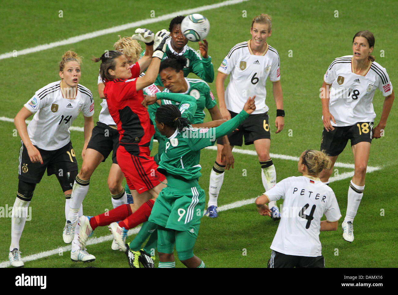 German goalkeeper Nadine Angerer (red) catches the ball next to team mate Kim Kulig (L) during the Group A match Germany against Nigeria of FIFA Women's World Cup soccer tournament at the FIFA Women's World Cup Stadium in Frankfurt, Germany, 30 June 2011. Foto: Roland Holschneider dpa/lhe  +++(c) dpa - Bildfunk+++ Stock Photo