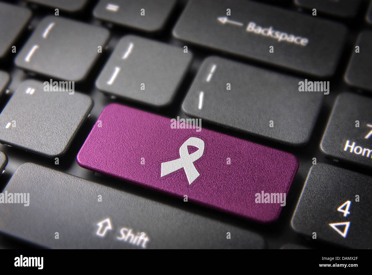 Health key with Cancer ribbon icon on laptop keyboard. Included ...