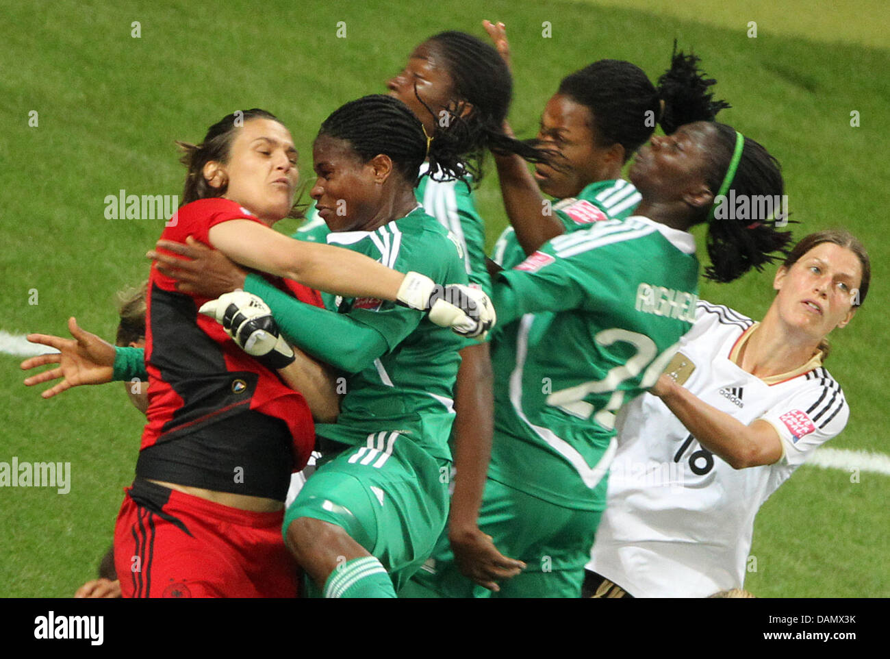 Germany's goalkeeper Nadine Angerer clashes with Nigerian players during the Group A match Germany against Nigeria of FIFA Women's World Cup soccer tournament at the FIFA Women's World Cup Stadium in Frankfurt, Germany, 30 June 2011. Foto: Roland Holschneider dpa/lhe  +++(c) dpa - Bildfunk+++ Stock Photo