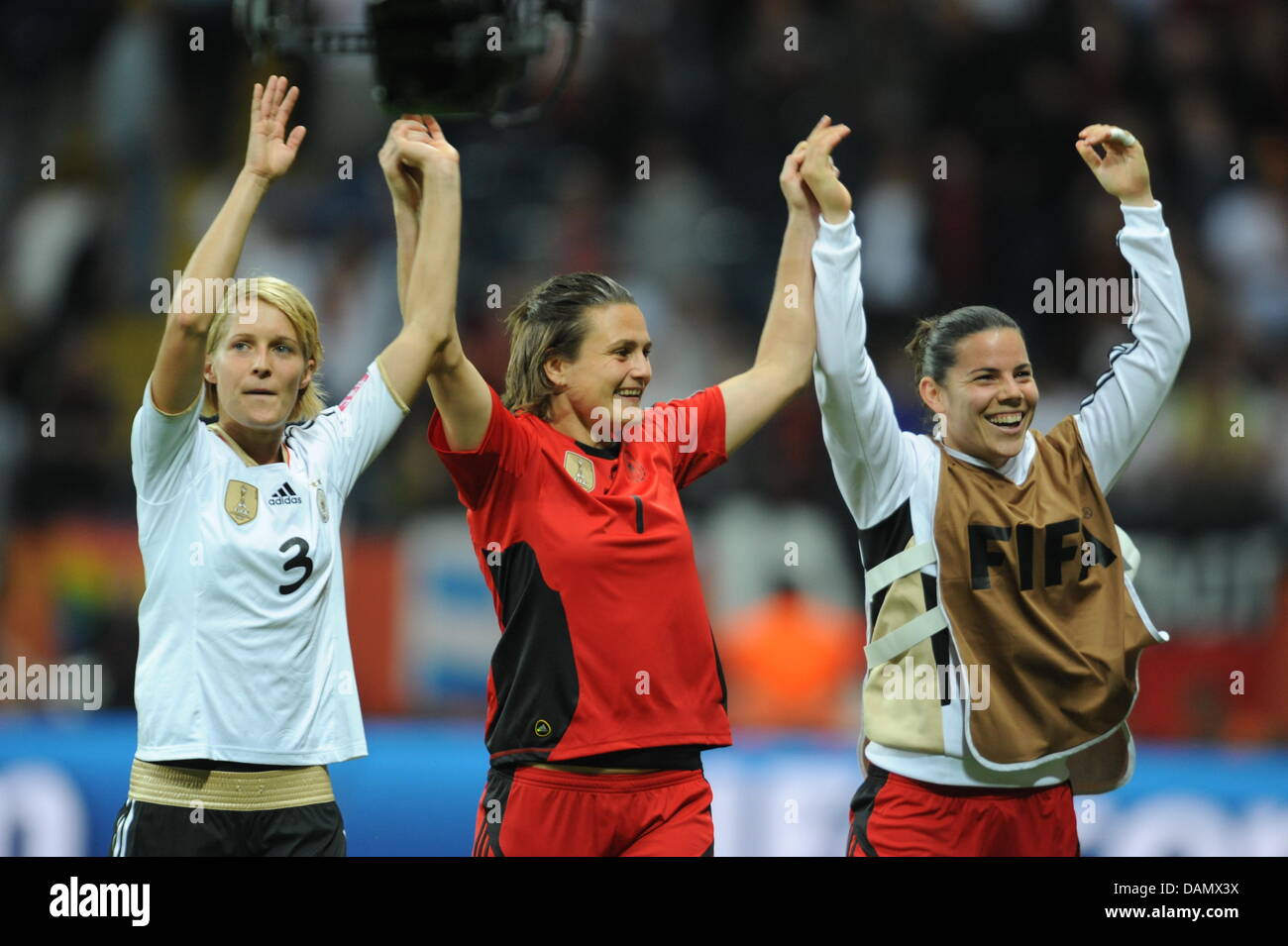 Germany's Saskia Bartusiak (L-R), goalkeeper Nadine Angerer and Ursula Holl celebrate after the Group A match Germany against Nigeria of FIFA Women's World Cup soccer tournament at the FIFA Women's World Cup Stadium in Frankfurt, Germany, 30 June 2011. Foto: Arne Dedert dpa/lhe  +++(c) dpa - Bildfunk+++ Stock Photo