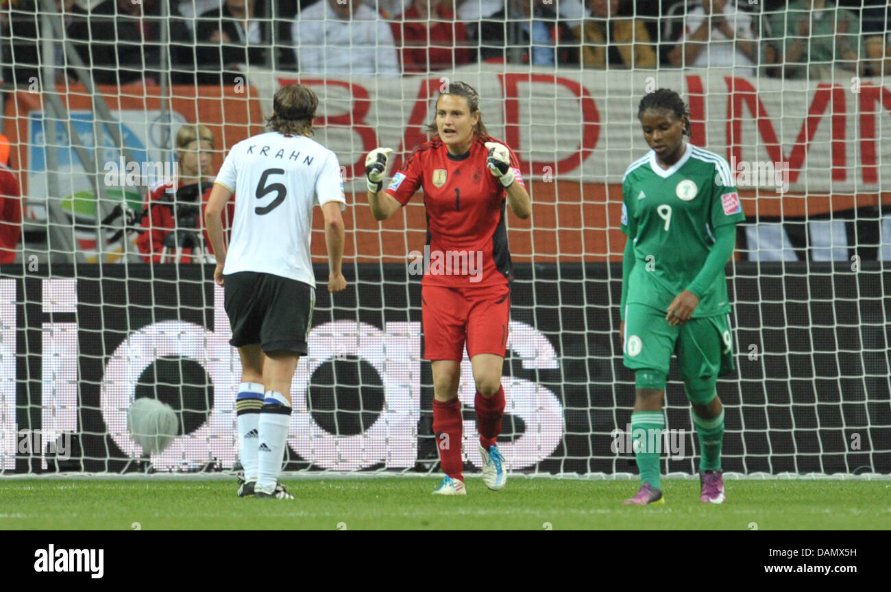Germany's goalkeeper Nadine Angerer (C) and Annike Krahn (l) cheer after winning the Group A match Germany against Nigeria of FIFA Women's World Cup soccer tournament at the FIFA Women's World Cup Stadium in Frankfurt, Germany, 30 June 2011. Germany won the match with 1-0. Foto: Carmen Jaspersen dpa/lhe Stock Photo