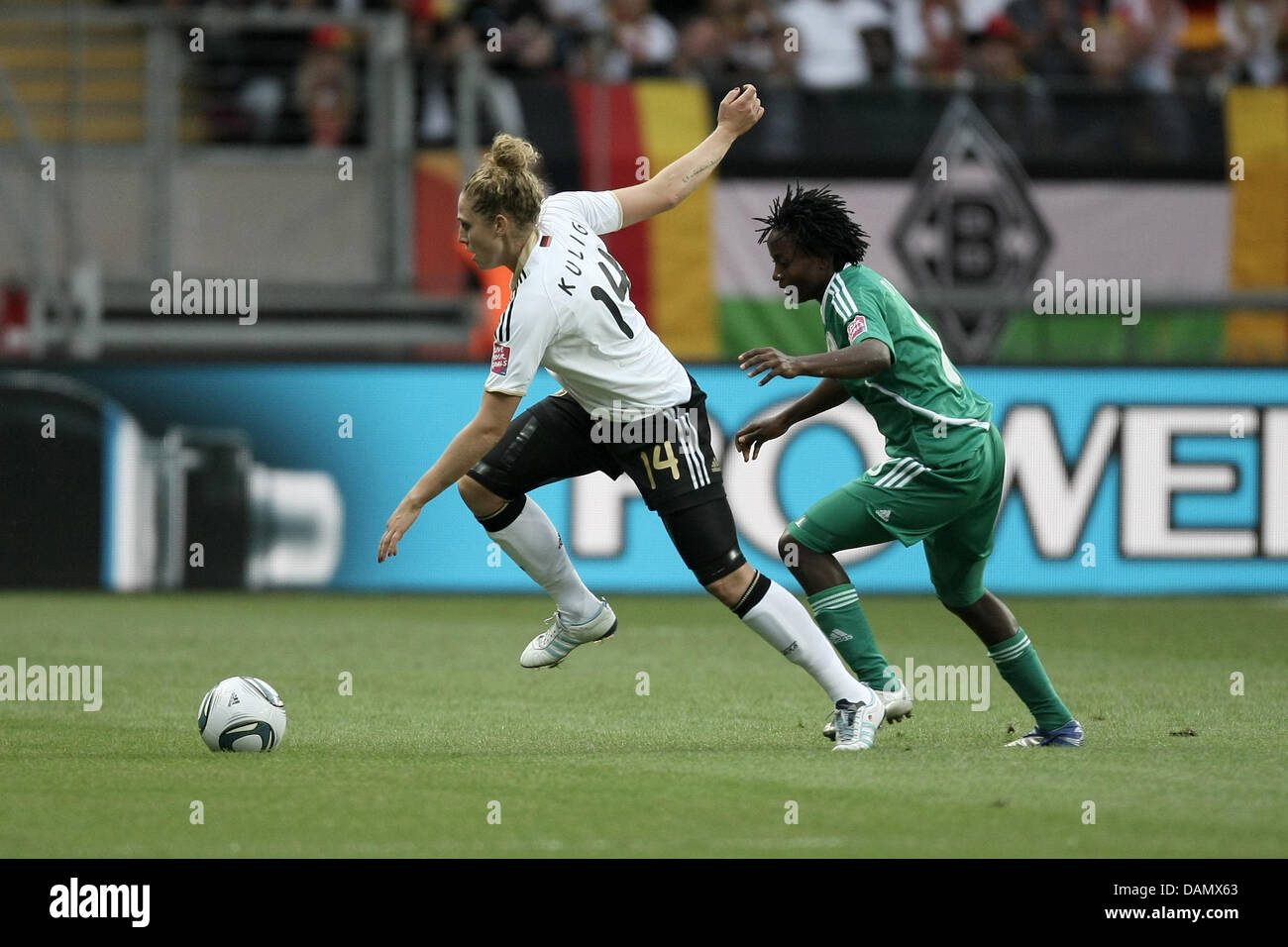 Kim Kulig (l) of Germany and Ebere Orji of Nigeria fight for the ball during the Group A match Germany against Nigeria of FIFA Women's World Cup soccer tournament at the FIFA Women's World Cup Stadium in Frankfurt, Germany, 30 June 2011. Foto: Fredrik von Erichsen dpa/lhe Stock Photo