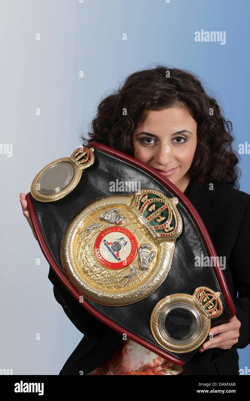 Armenian-born boxing world champion Susianna Kentikian poses on a photo call during the German television talk show 'Riverboar' in Leipzig, Germany, 24 June 2011. 23-year old Kentikian is three-times world champion and owns the boxing belts of the WBA, WBO and WIBF boxing federations. Kentikian 1.54 metres tall, weighs 51 kilogrammes and won in 27 fights and 27 wins, 16 of those th Stock Photo