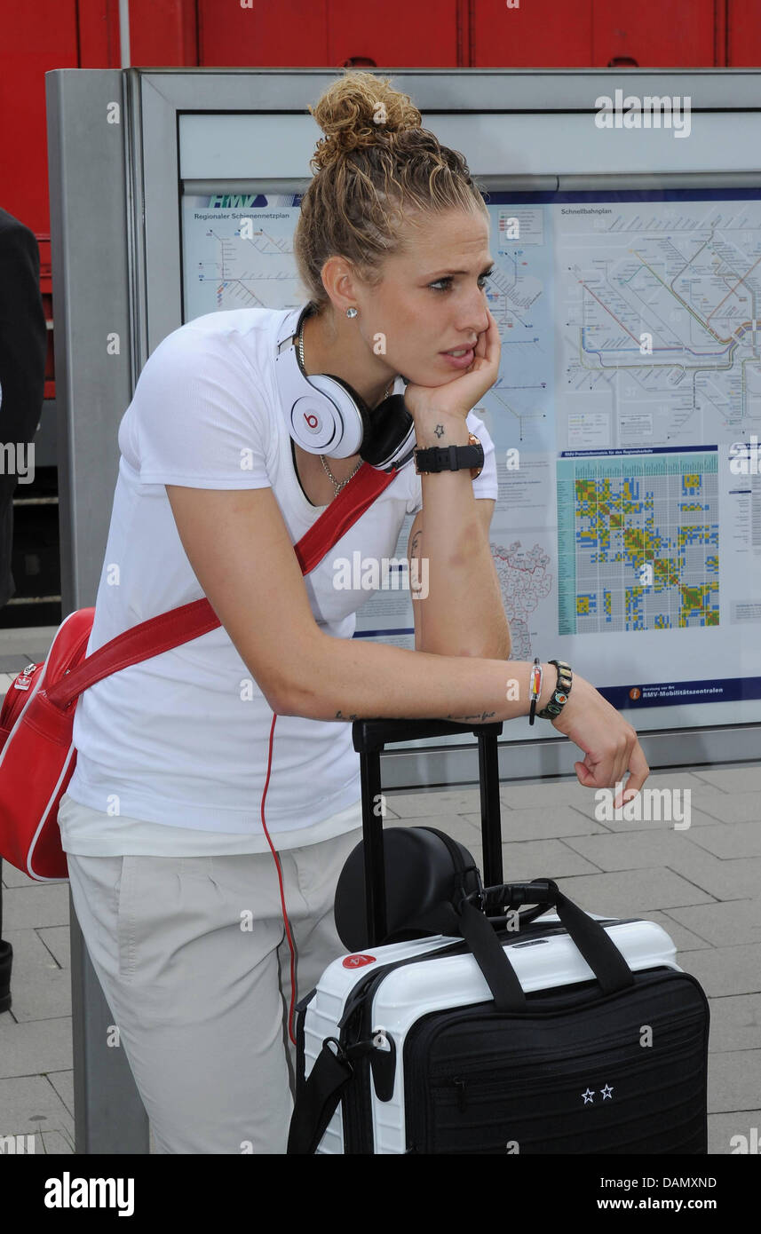 German women's national soccer player Kim Kulig waits for the ICE train from Frankfurt to Duesseldorf, Germany, 01 July 2011. Germany's next FIFA Women's World Cup match will take place in Moenchengladbach on 5 July 2011. Photo: Markus Gilliar/GES-Sportfoto/DFB Stock Photo