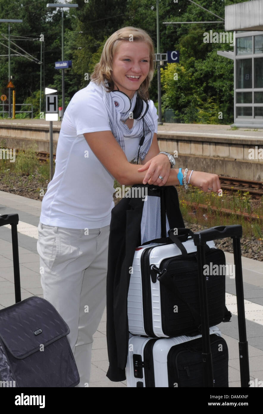 German women's national soccer player Alexandra Popp waits for the ICE train from Frankfurt to Duesseldorf at the station in Frankfurt am Main, Germany, 01 July 2011. Germany's next FIFA Women's World Cup match will take place in Moenchengladbach on 5 July 2011. Photo: Markus Gilliar/GES-Sportfoto/DFB Stock Photo
