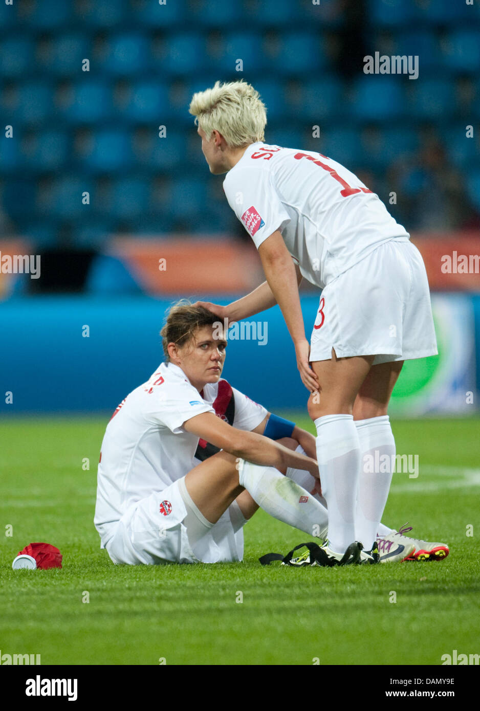 Dejected Christine Sinclair (L) and Sophie Schmidt of Canada after the Group A match Canada against France of FIFA Women's World Cup soccer tournament at the FIFA Women's World Cup Stadium in Bochum, Germany, 30 June 2011. France defeated Canada with 4-0. Foto: Bernd Thissen dpa/lnw Stock Photo